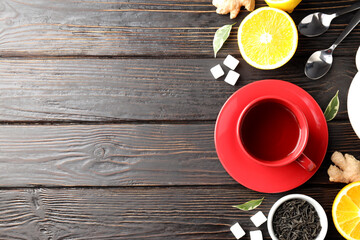 Fototapeta na wymiar Concept of hot drink with tea on dark wooden background