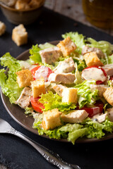 Green vegetable salad with lattuce, chicken and croutons. Healthy food concept