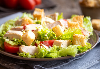 Green vegetable salad with lattuce, chicken and croutons. Healthy food concept