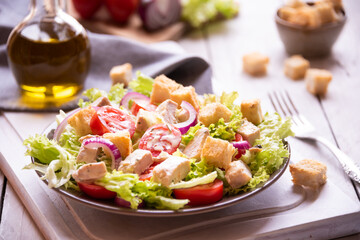 Caesar salad with vegetables, chicken and croutons
