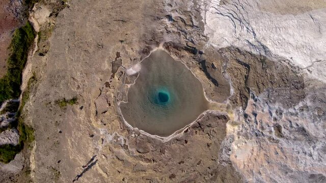 Aerial Cinematic footage of the Impressive Icelands Geysir Geisir in the Golden Circule, the geothermal activity and a attraction for tourists in Iceland	