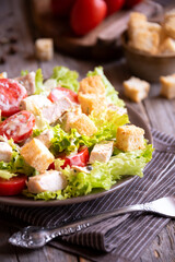 Caesar salad with vegetables, chicken and croutons