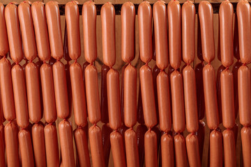 Lots of Frankfurter sausage hanging in the warehouse