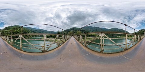 full seamless 360 hdri panorama on on metal bridge over fast river in mountains with in...