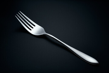 Fork on dark backdrop