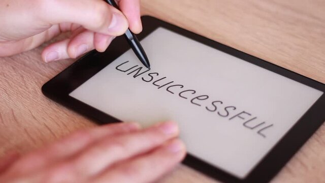 Writing UNSUCCESSFUL on Electronic tablet and crossing it out