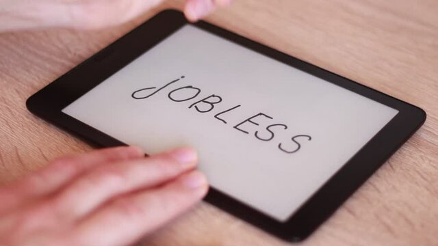Inscription JOBLESS on Electronic tablet