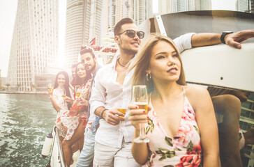 Group of friends making party on a yacht in Dubai