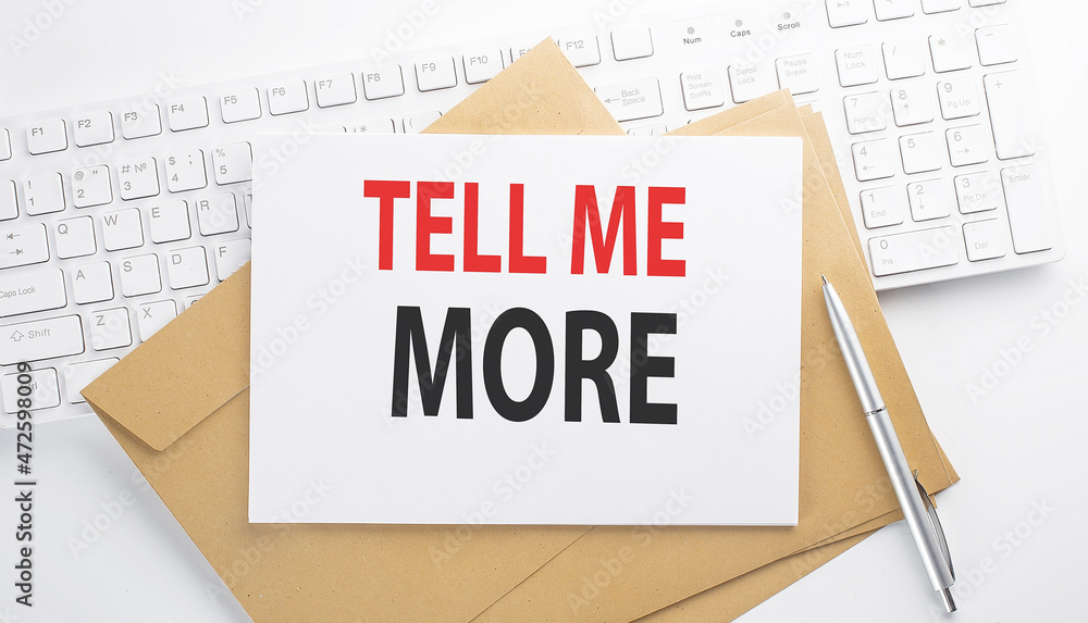 Poster text tell me more on the envelope on the keyboard