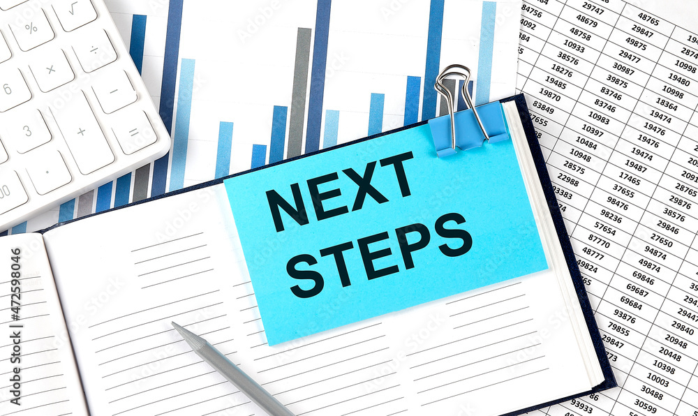 Poster next steps text on blue sticker on the chart background near calculator