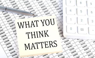 WHAT YOU THINK MATTERS - business concept, message on sticker on chart background