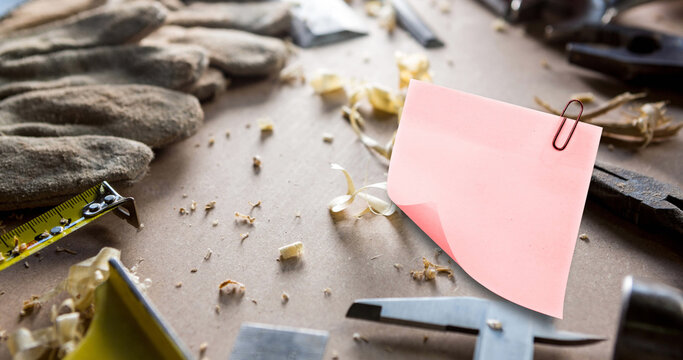 Image of memo note with copy space over carpenter's work surface