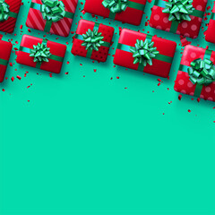 Christmas red gift boxes on green background.