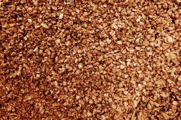 Asphalt road closeup in orange tone.
