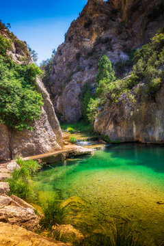 The walkways of the parrizal over the Matarra&Atilde;&plusmn;as river located in Beceite, Teruel, wonderful national park with lush pine forests for a nice walk and relax in nature, Spain..