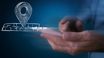 hand presses the geolocation icon on the map on the phone