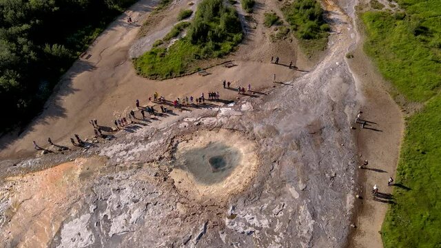 Aerial Cinematic footage of the Impressive Icelands Geysir Geisir in the Golden Circule, the geothermal activity and a attraction for tourists in Iceland	