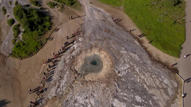 Aerial Cinematic footage of the Impressive Icelands Geysir Geisir in the Golden Circule, the geothermal activity and a attraction for tourists in Iceland	
