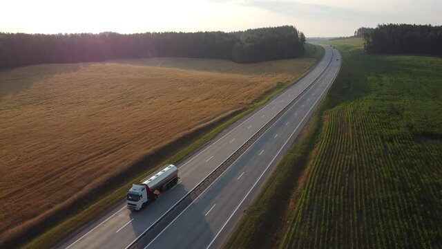 Tank truck with gasoline, gas or other fuel, oil trailer, highway truck. Transportation by land, cargo and oil delivery. High quality 4k footage