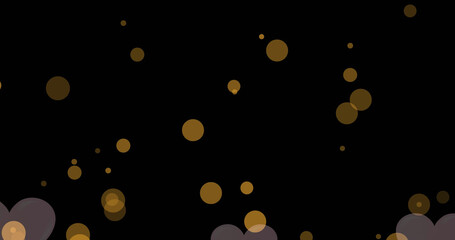 Image of pink heart floating with gold spots over black background