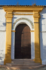 Main door of the Church of Santo Domingo in the village of Benalauria in the Genal Valley, Malaga. Spain