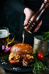 Delicious burgers with beef, tomato, cheese and lettuce