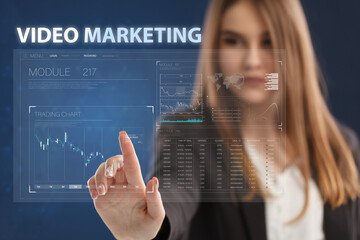 Business, Technology, Internet and network concept. Young businessman working on a virtual screen of the future and sees the inscription: Video marketing