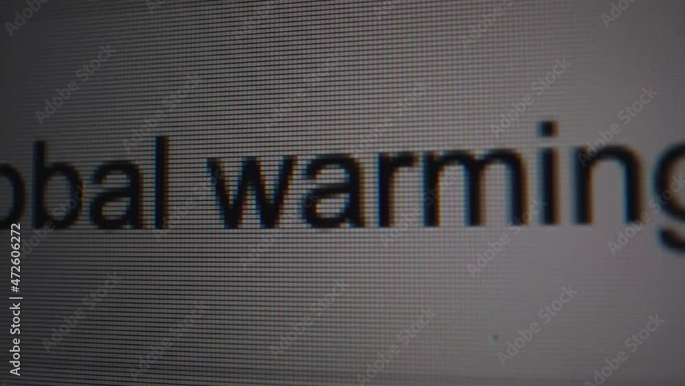 Poster close up shot of a computer monitor. a person is typing in google search bar 'is global warming a my