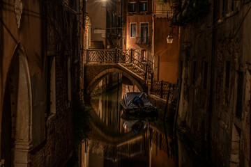 Small footbridge across a canal at night