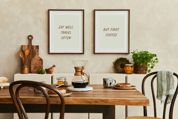 Elegant composition of stylish dining room intrerior with mock up poster frames, beige sideboard, family dining table, plants and vintage personal accessories. Copy space. Template. Autumn vibes.