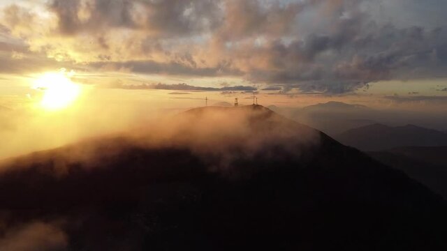 Full HD resolution raw aerial footage of golden clouds above the mountains - Italian landscapee