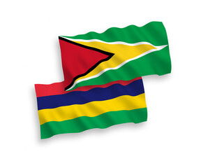 Flags of Co-operative Republic of Guyana and Republic of Mauritius on a white background