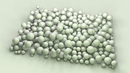 3d rendering of a variety of green spheres of different sizes on the surface. The spheres are arranged in a square. Abstract 3d composition.