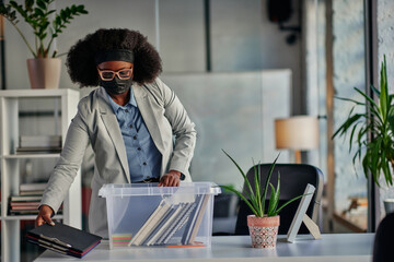 African businesswoman take out supplies at her worktable