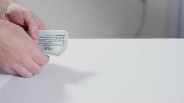 Two men completing a transaction as payment is made
