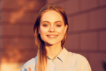 Business woman in a cafe in the summer outdoors on vacation