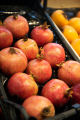 Pomegranate fruits isolated in market store