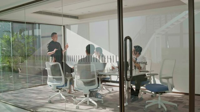 Business people having meeting in board room,4K