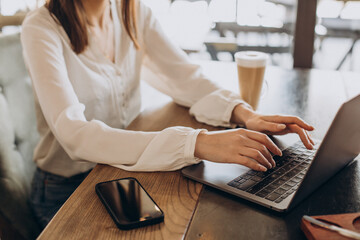 Female hands typing on computer close up