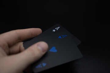 Winning poker hand. Cards on a black background.