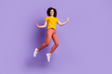 Fototapeta na wymiar Full size photo of young lovely woman good mood energetic jump up isolated over violet color background