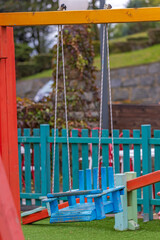 Fototapeta na wymiar Wooden Swings Playground
