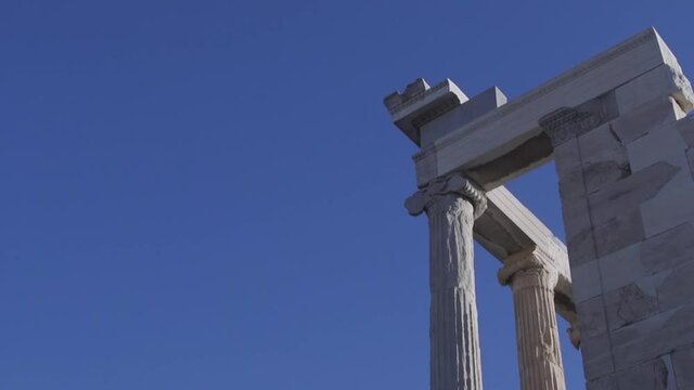 Detail of the Parthenon with blue sky background, at the Acropolis, Athens, Greece.