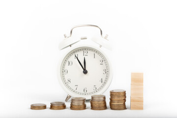 growing pile of money and alarm clock. economy and tax concept. isolated white background.