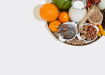 Elimination diet concept. Food allergens on plate - fish, seafood, dairy, peanuts, tree nuts, eggs, chocolate, wheat, soy, citrus fruits.