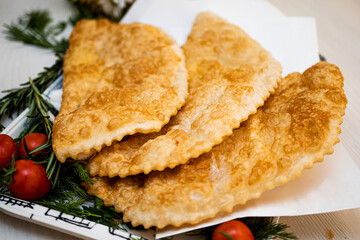 Juicy pasties with meat with a golden crust