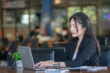 Portrait of a beautiful young woman working in the office.