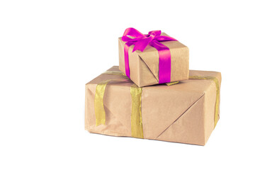 Holiday or Christmas gift boxes background. Gift box wrapped in Kraft paper with ribbon on white background.