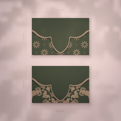 Presentable business card in green color with brown mandala ornament for your business.