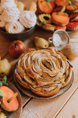 Obraz na płótnie Canvas apple pie charlotte closeup. homemade cakes, sweets and fruits are on the wooden kitchen table. High quality photo